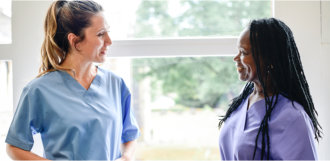 nurses talking in hallway